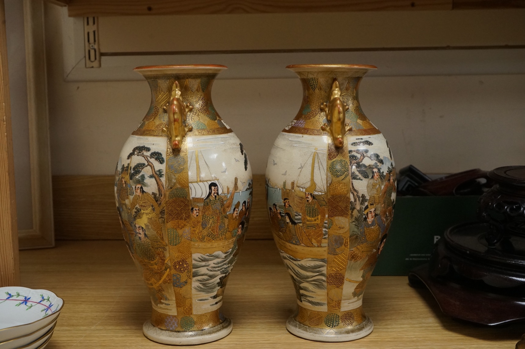 A pair of Japanese Satsuma pottery vases, Meiji period, 31cm high